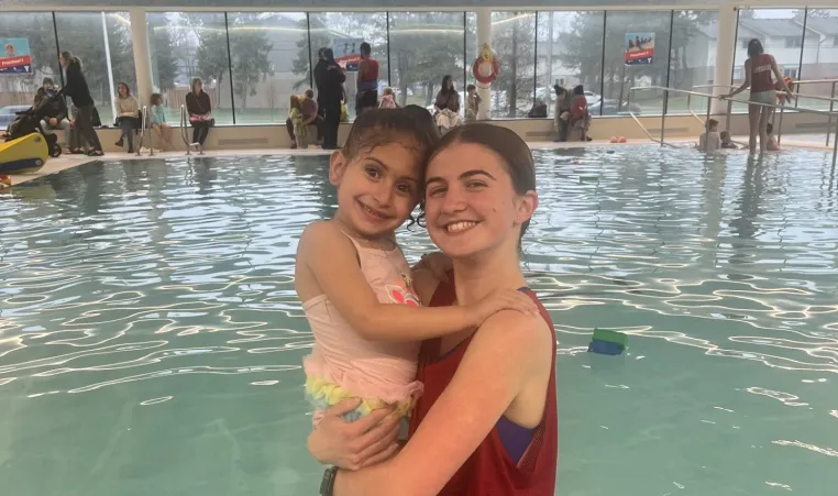 Child and Instructor in Pool