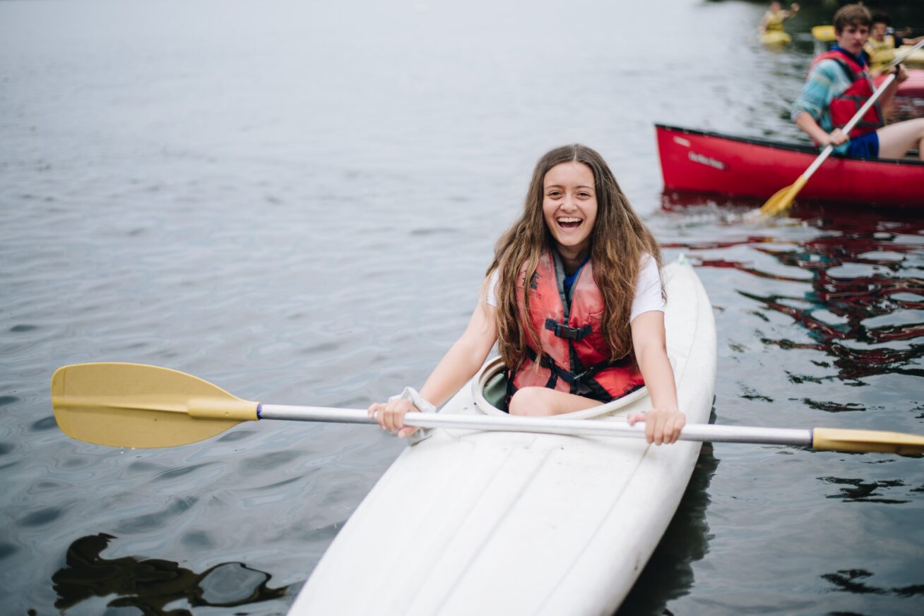 Happy girl kayaking