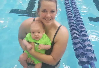 Julie holds her 4 month old son Joey in the St. Thomas YMCA pool.