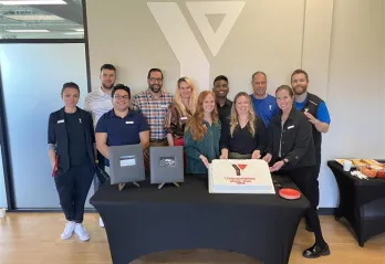 People celebrating around a cake