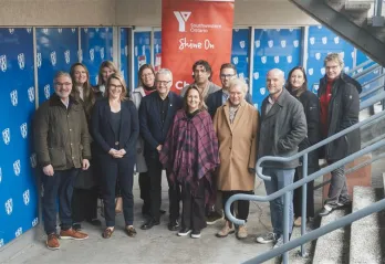 Group of adults at the bottom of a stairwell