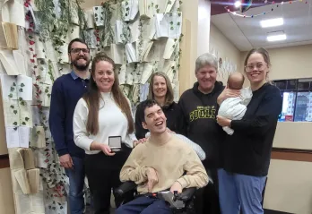 Rachel Guerin - 2025 Peace Week Recipient standing with group of smiling people