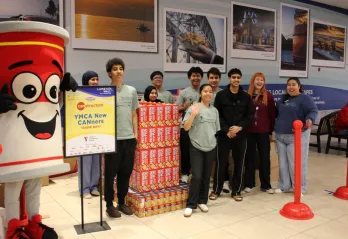 Young adults in front of Game Boy construction