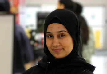 Zeina sitting and looking at the camera