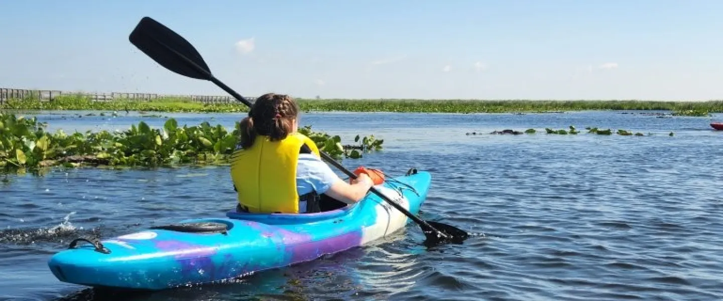 girl kayaking at Camp Henry