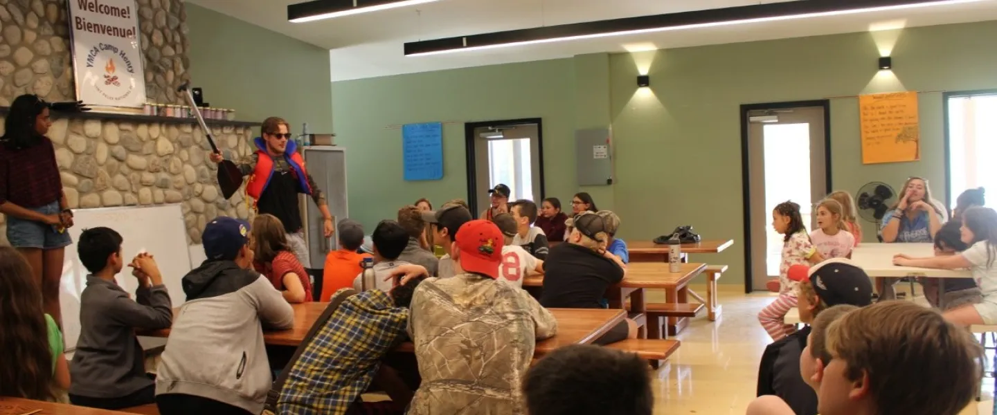 kids watching a presentation at Camp Henry