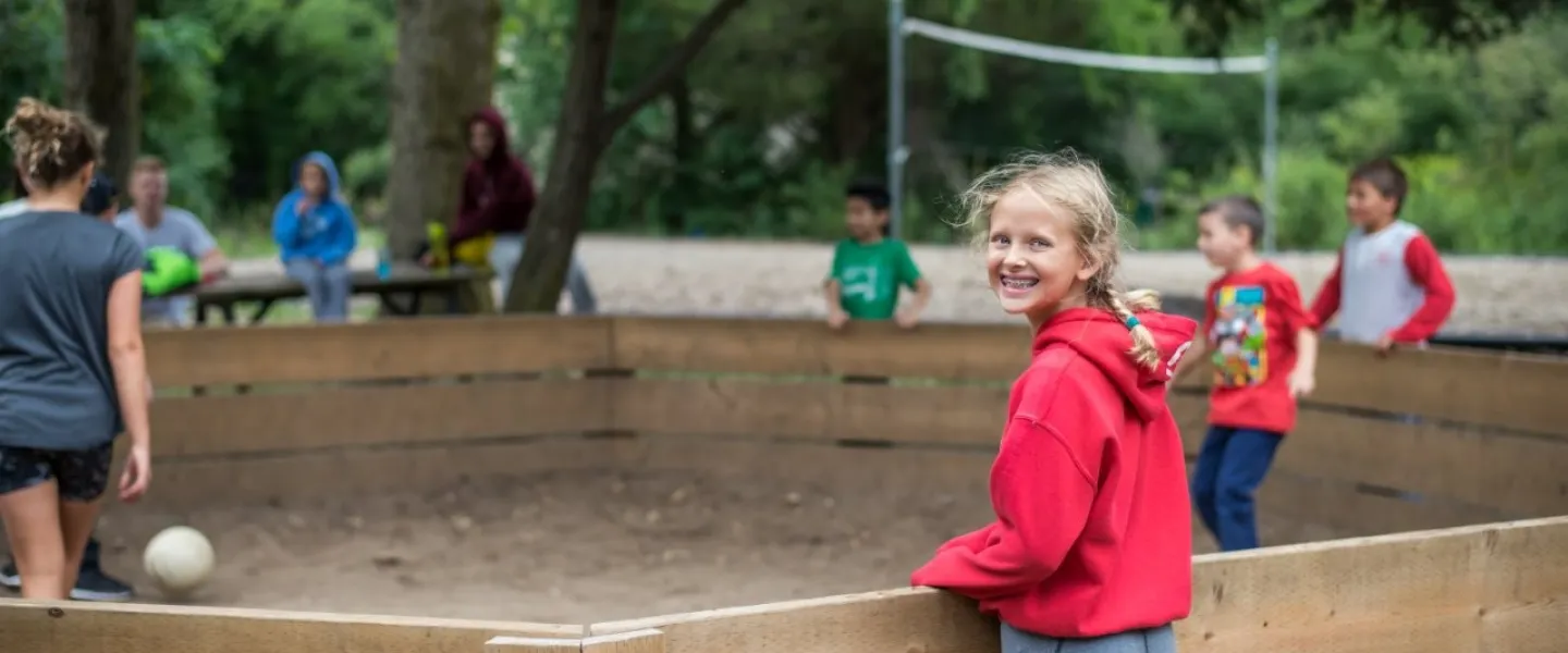 kids playing at gaga ball pit at Camp Henry