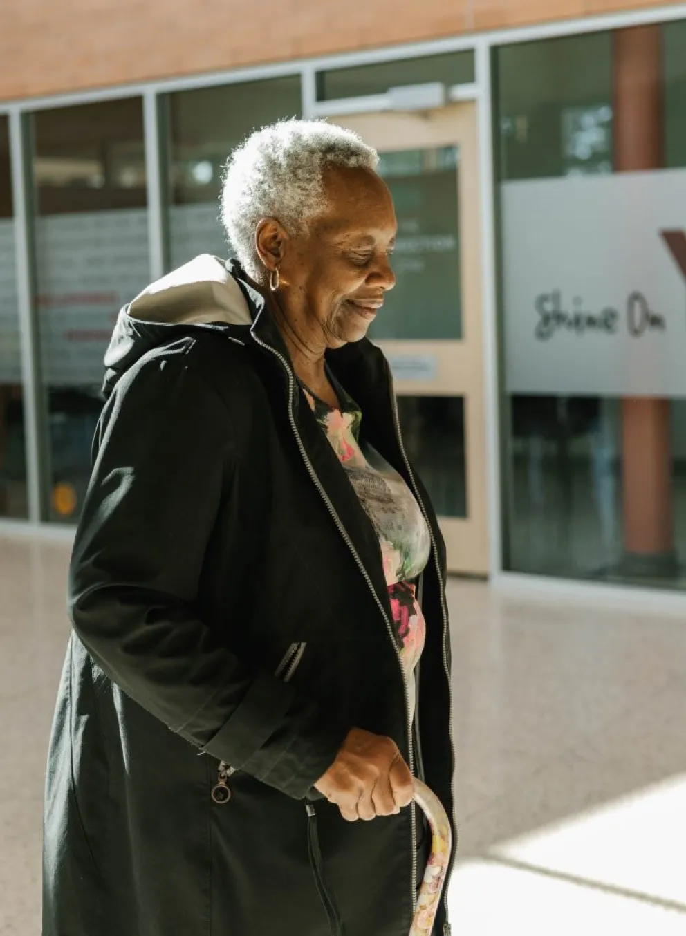 Woman in front of YMCA building