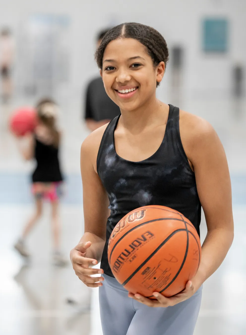 Girl holding basketball