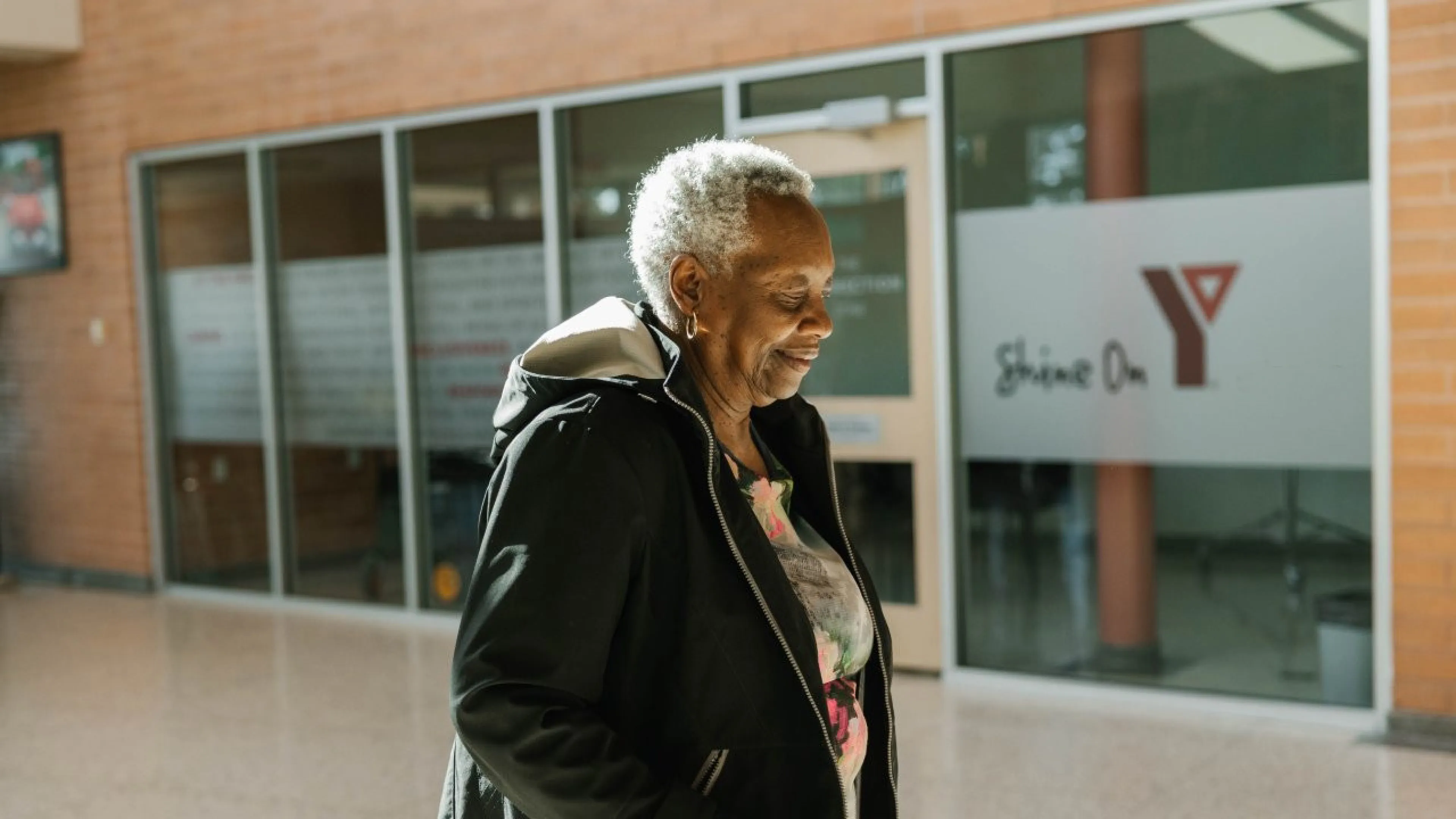 Woman in front of YMCA building