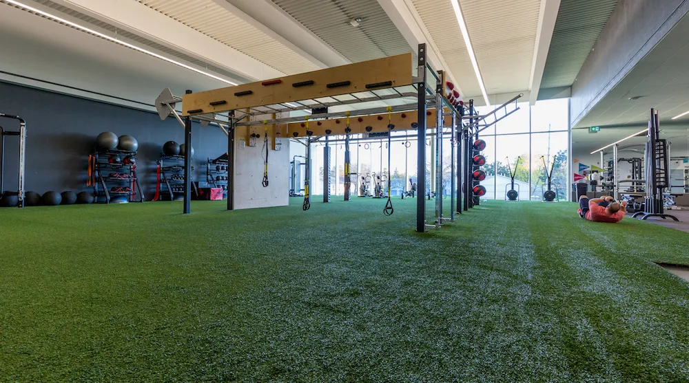 The Bostwick indoor Turf Zone with fitness equipment.