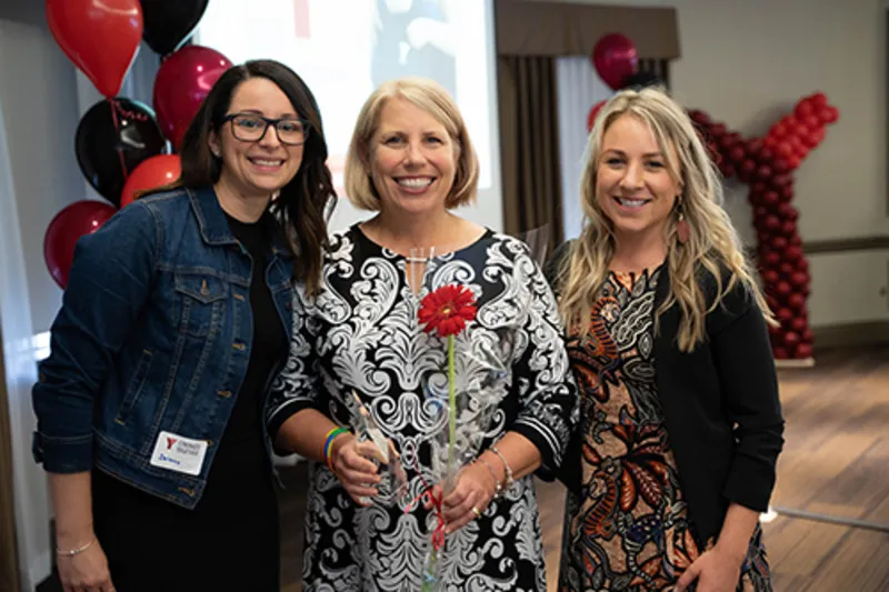 Staff members socialize at the event.