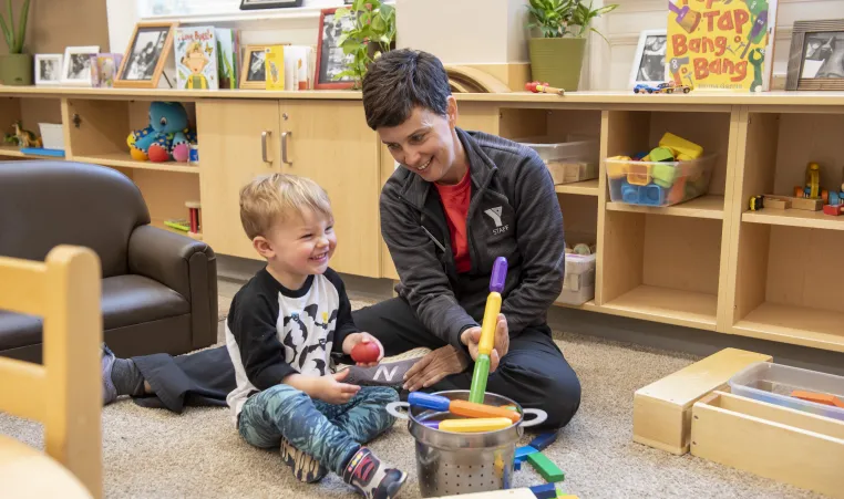 Boy and Staff in Child Care