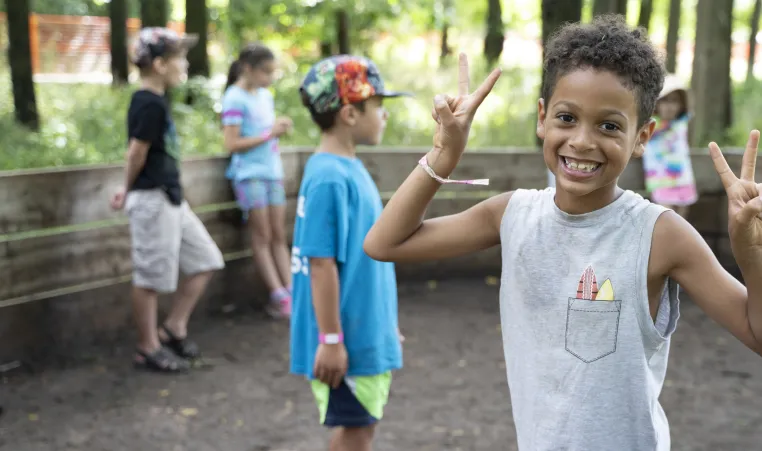 Boy smiling enjoying camp