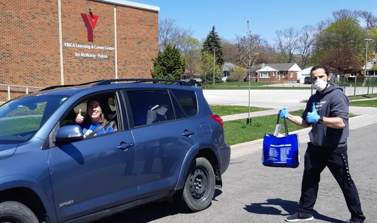 Y Staff Members prepare to deliver care packages to Sarnia residents at the Y Learning and Careers Centre.
