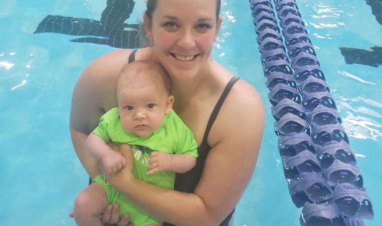 Julie holds her 4 month old son Joey in the St. Thomas YMCA pool.