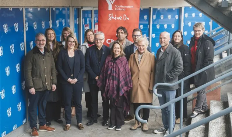Group of adults at the bottom of a stairwell