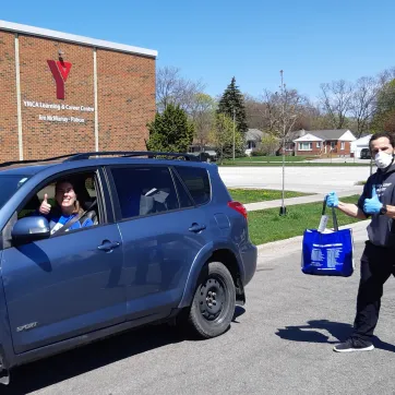 Y Staff Members prepare to deliver care packages to Sarnia residents at the Y Learning and Careers Centre.