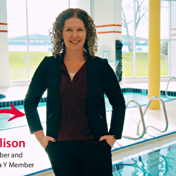 Meet Alison: Board Member and Lifelong Sarnia Y Member. Alison, wearing a black suit and burgundy blouse, stands on the pool deck at the Sarnia YMCA.