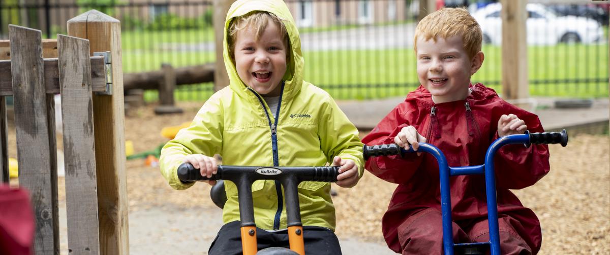 Boys riding bikes outside