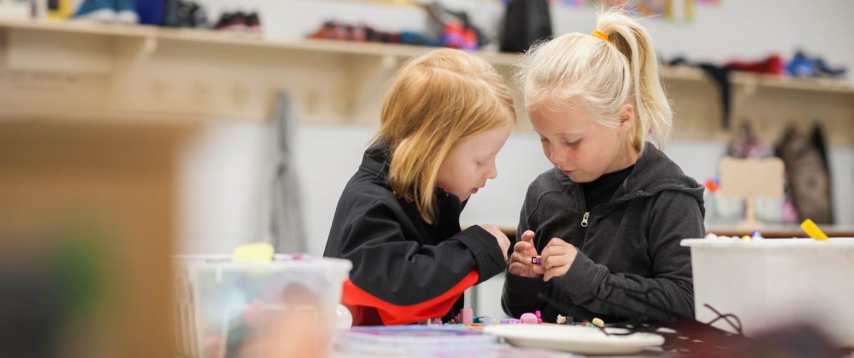 Two girls working together on a craft