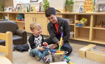 Boy and Staff in Child Care