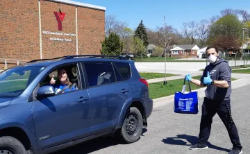 Y Staff Members prepare to deliver care packages to Sarnia residents at the Y Learning and Careers Centre.