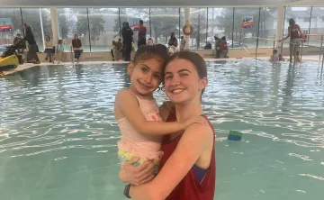 Child and Instructor in Pool