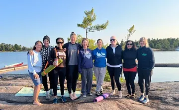 Women on rock after Yoga