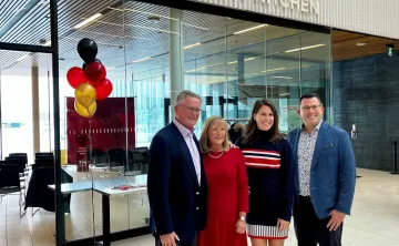 Bierbaum Family stands in front of Community Kitchen