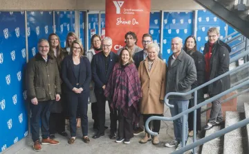 Group of adults at the bottom of a stairwell