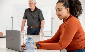 Woman at computer in classroom