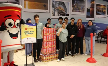 Young adults in front of Game Boy construction