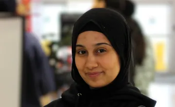 Zeina sitting and looking at the camera